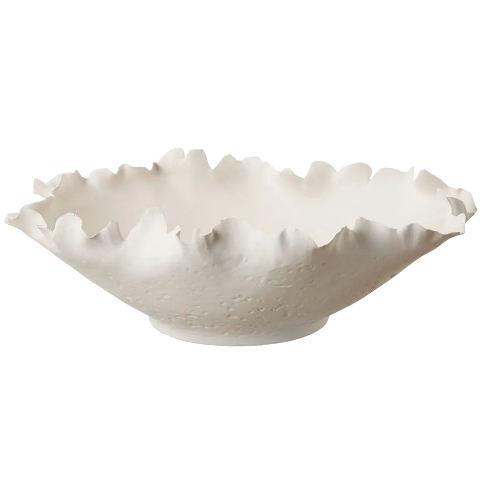 White ceramic bowl with textured rim on a white background
