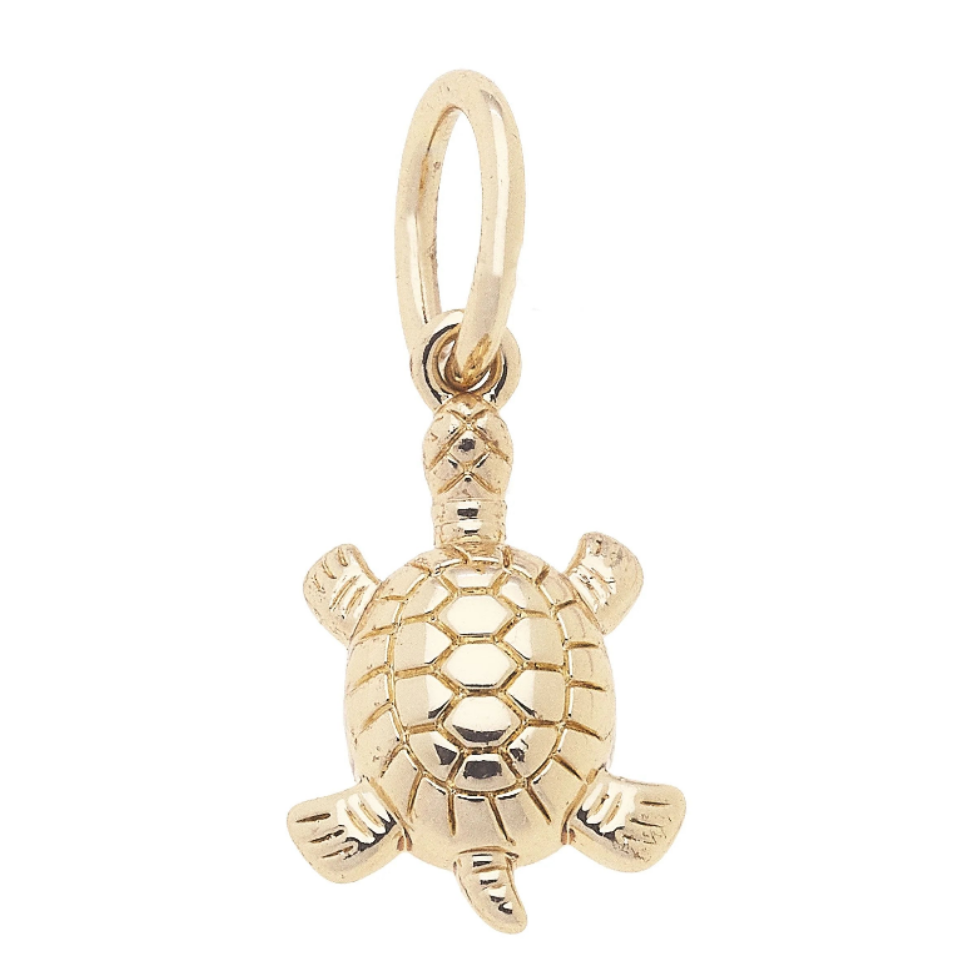 A small gold turtle charm pendant with a textured shell and a hanging loop at the top, shown on a plain white background.