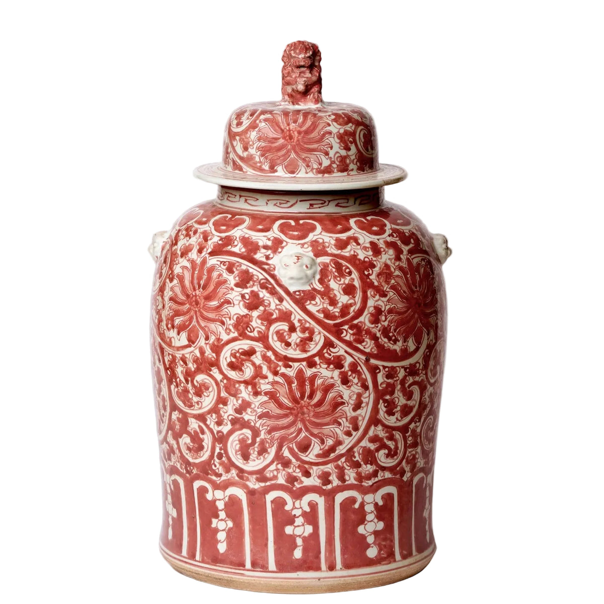 Decorative ceramic jar with red and white patterns on a gray background