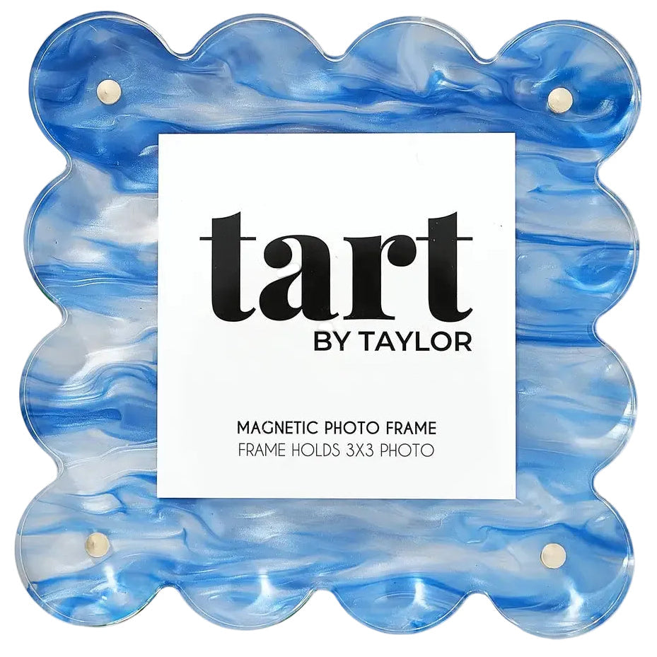 A scalloped acrylic magnetic photo frame in a blue and white marbled pattern, featuring a white insert card with the brand name 'tart BY TAYLOR' printed in black.