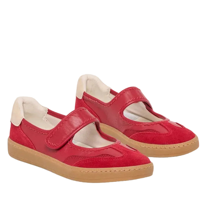 A pair of red children's Mary Jane-style sneakers with hook-and-loop straps, cream lining, and tan soles, photographed on a light gray background.