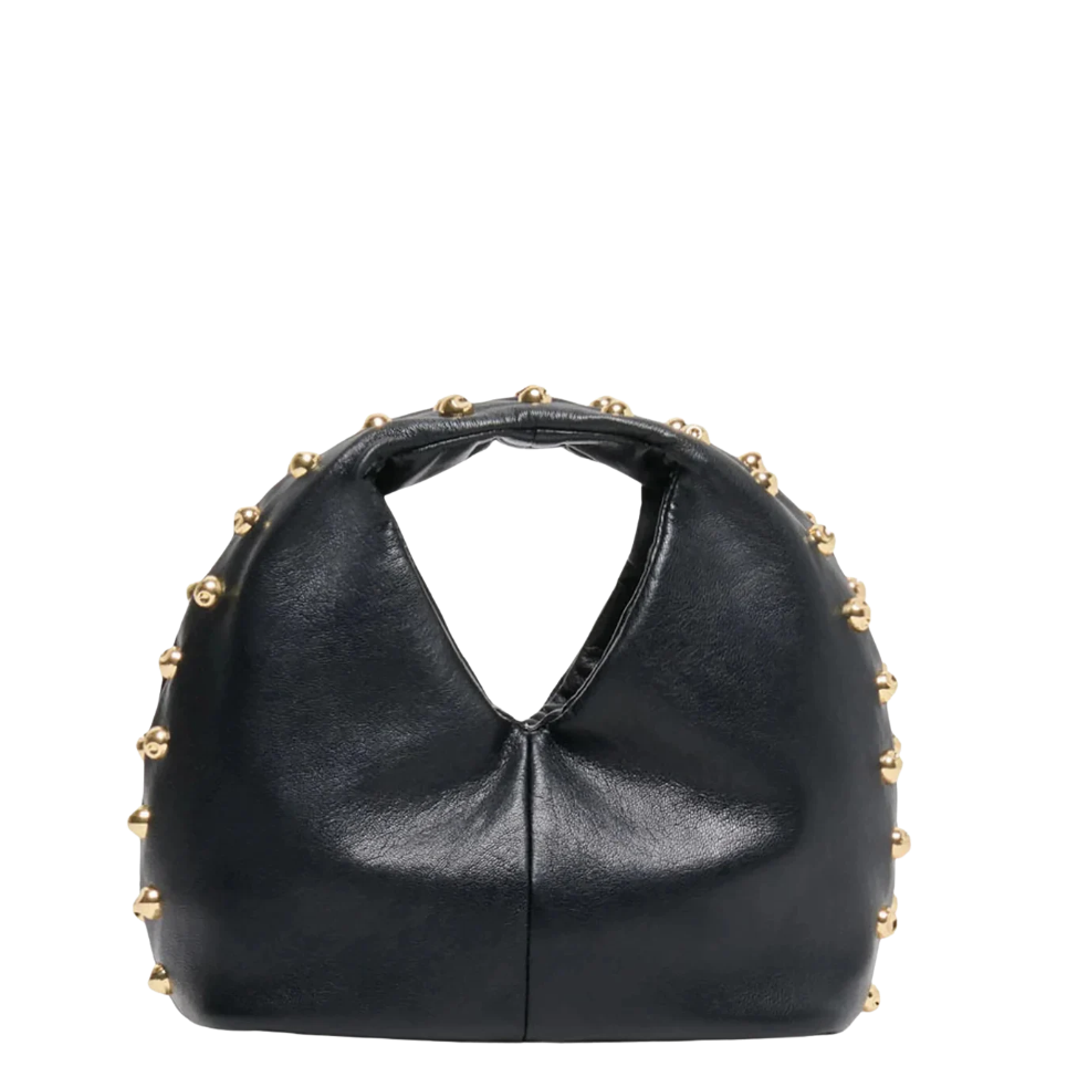 A black leather crescent-shaped handbag with a split top handle and gold-tone studs along the edges, shown against a plain white background.