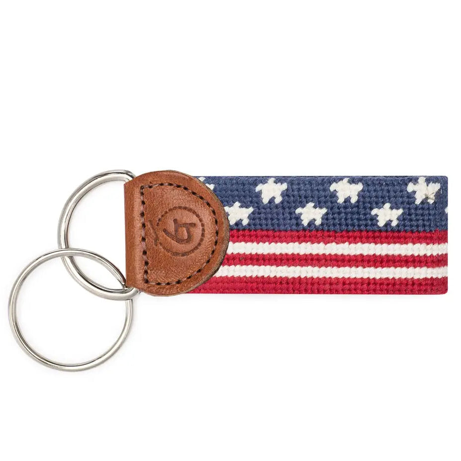 Keychain with American flag pattern and leather accent on a white background