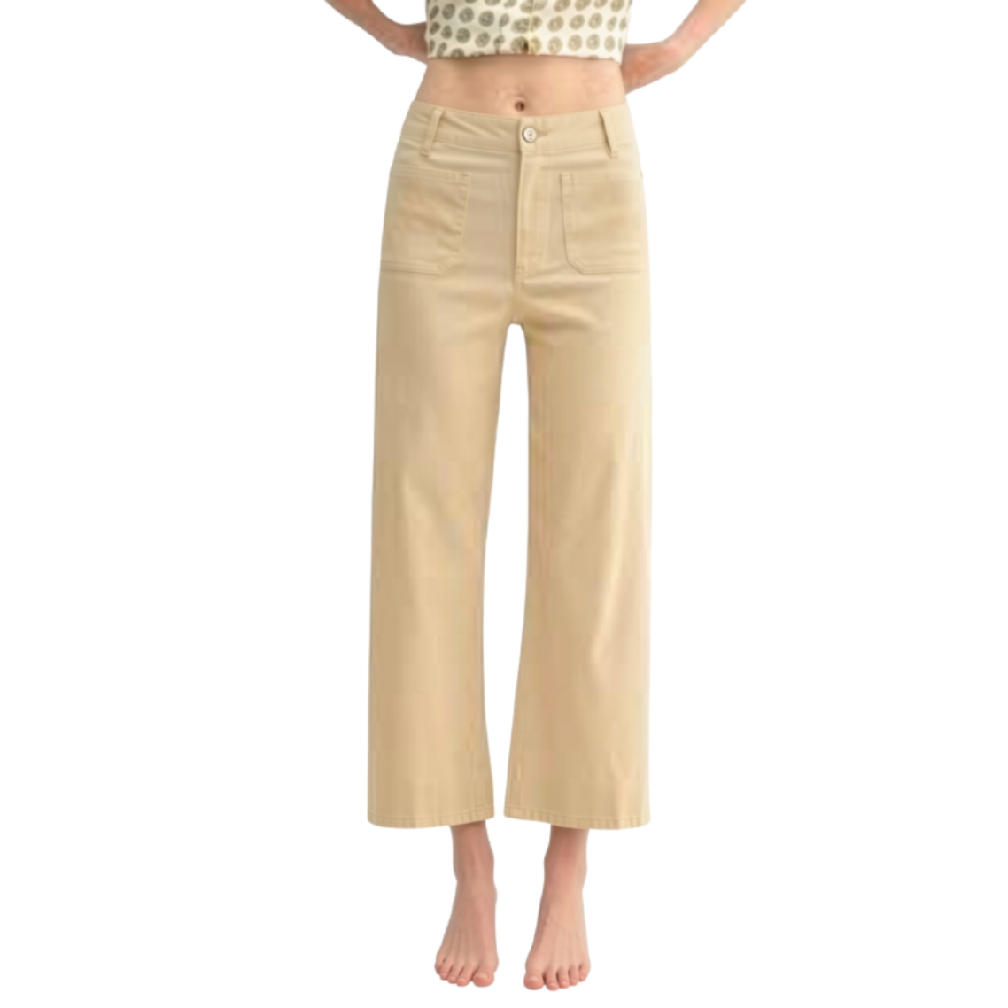 A model is shown from the waist down wearing a pair of beige wide-leg cropped pants, standing barefoot against a solid white background.
