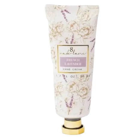 A tube of hand cream with a white and lavender floral pattern and a gold cap, centered on a plain white background.