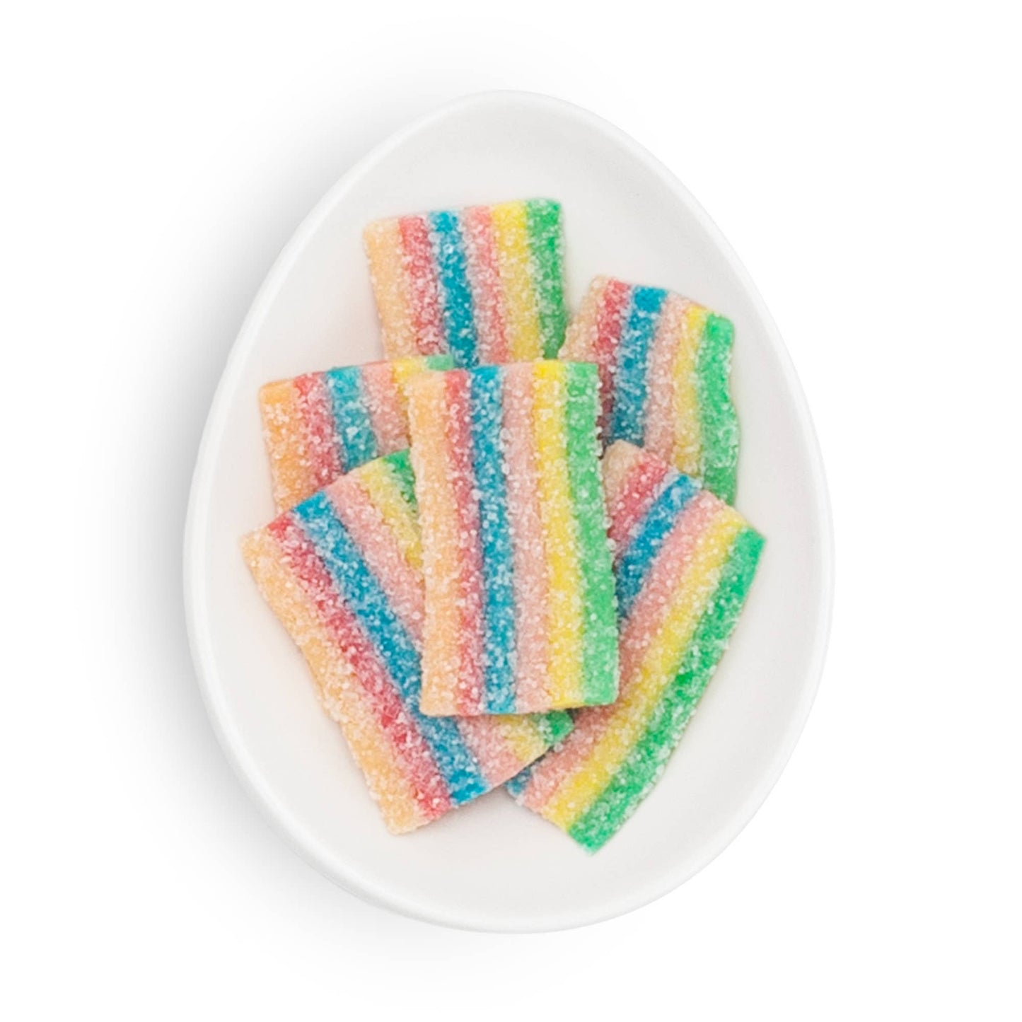 Colorful striped candy on a white plate