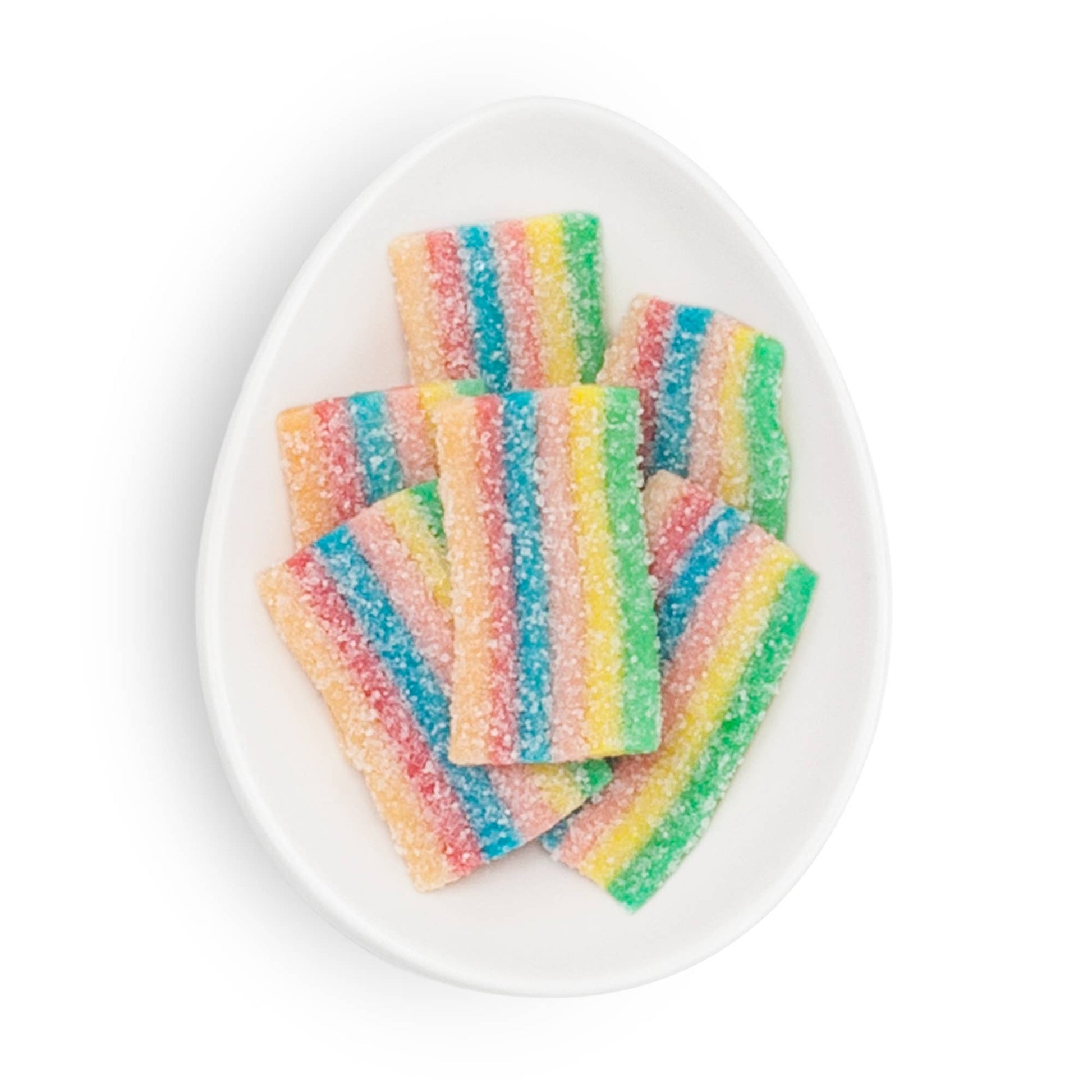 Colorful striped candy on a white plate