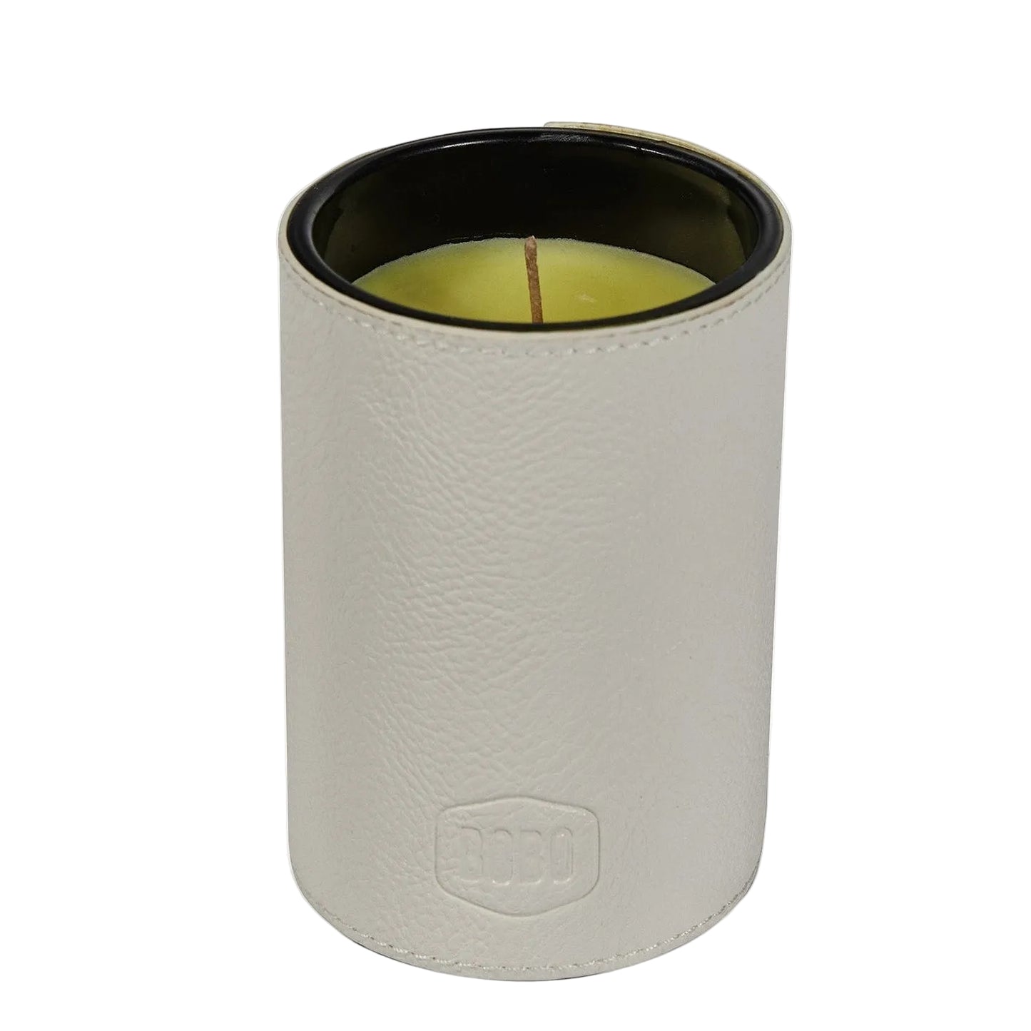 A cylindrical candle in a light beige textured leather-like sleeve with a black interior and pale yellow wax, shown on a white background. An embossed shield logo with 'ROBO' is visible near the bottom.