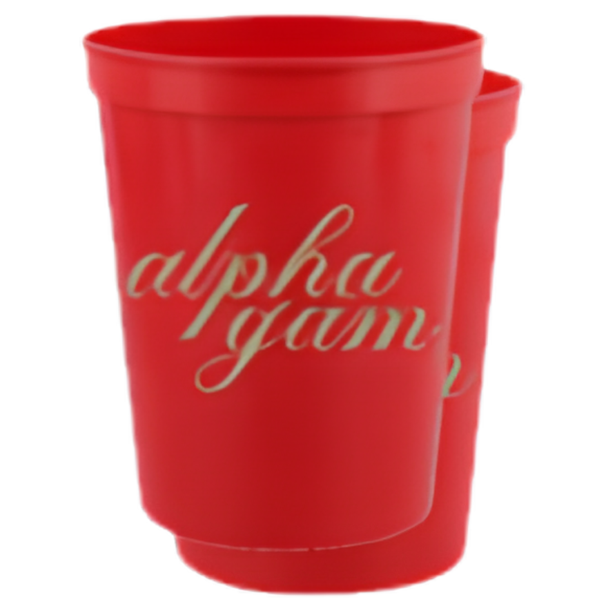 A red plastic cup with the words 'alpha gam' printed in light green cursive script on the front, shown on a plain white background.