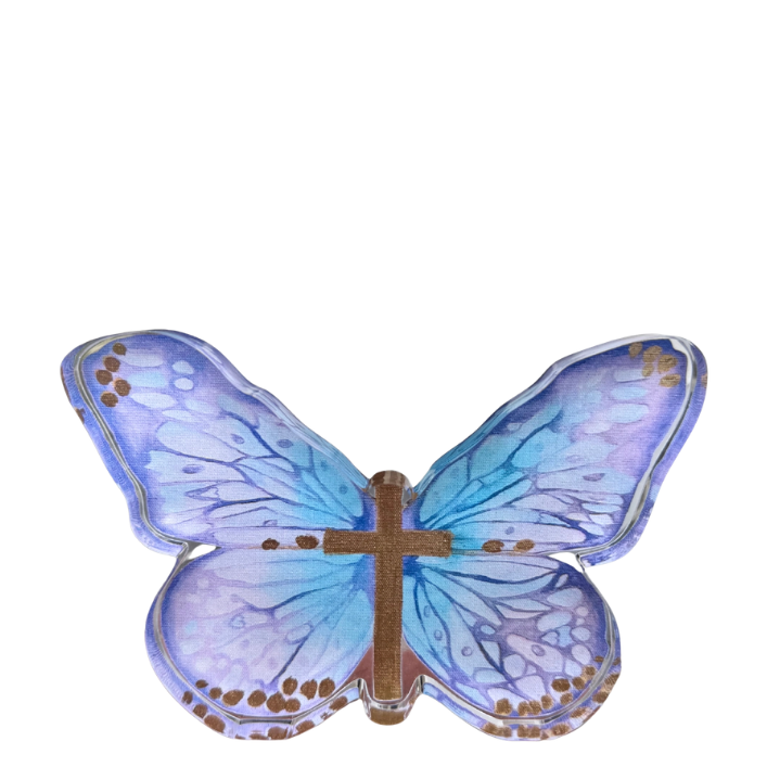 A butterfly-shaped acrylic shelfie featuring iridescent blue and purple wings with brown spots and a metallic brown cross at the center, isolated on a white background.
