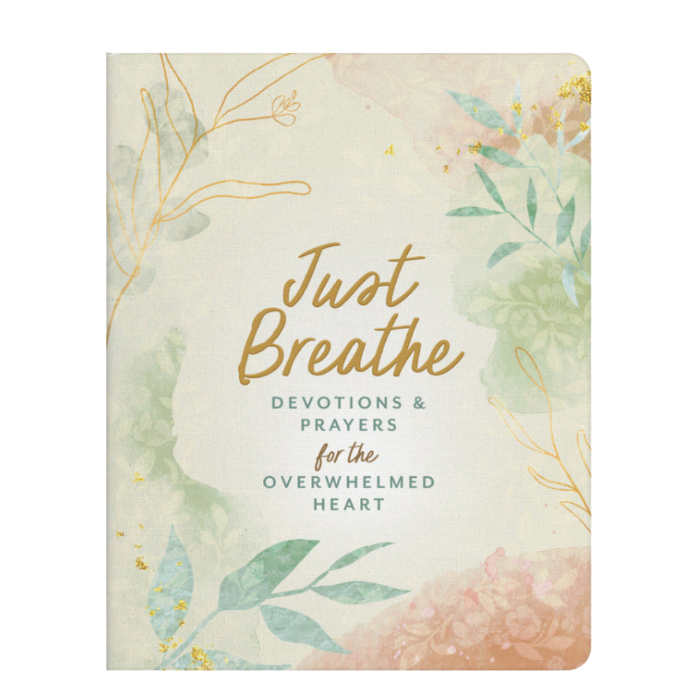 A devotional book titled 'Just Breathe: Devotions & Prayers for the Overwhelmed Heart' with a soft watercolor floral design in pastel green, peach, and gold on a cream background.