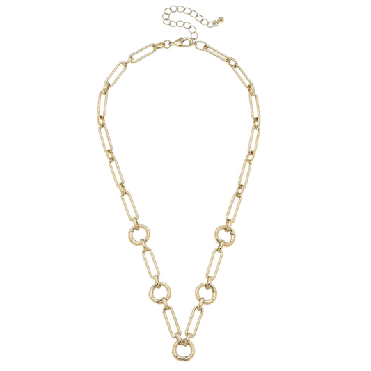 A gold-toned link necklace featuring elongated oval links, circular ring links, and a delicate extender chain with a lobster clasp, displayed on a solid white background.