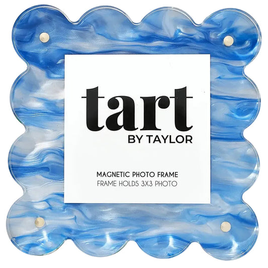 A scalloped acrylic magnetic photo frame in a blue and white marbled pattern, featuring a white insert card with the brand name 'tart BY TAYLOR' printed in black.