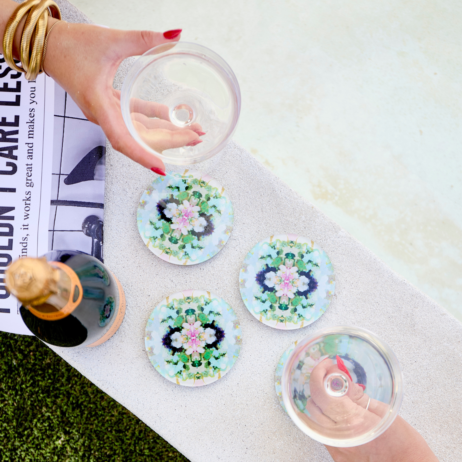 Decorative coasters with floral designs on a white surface.