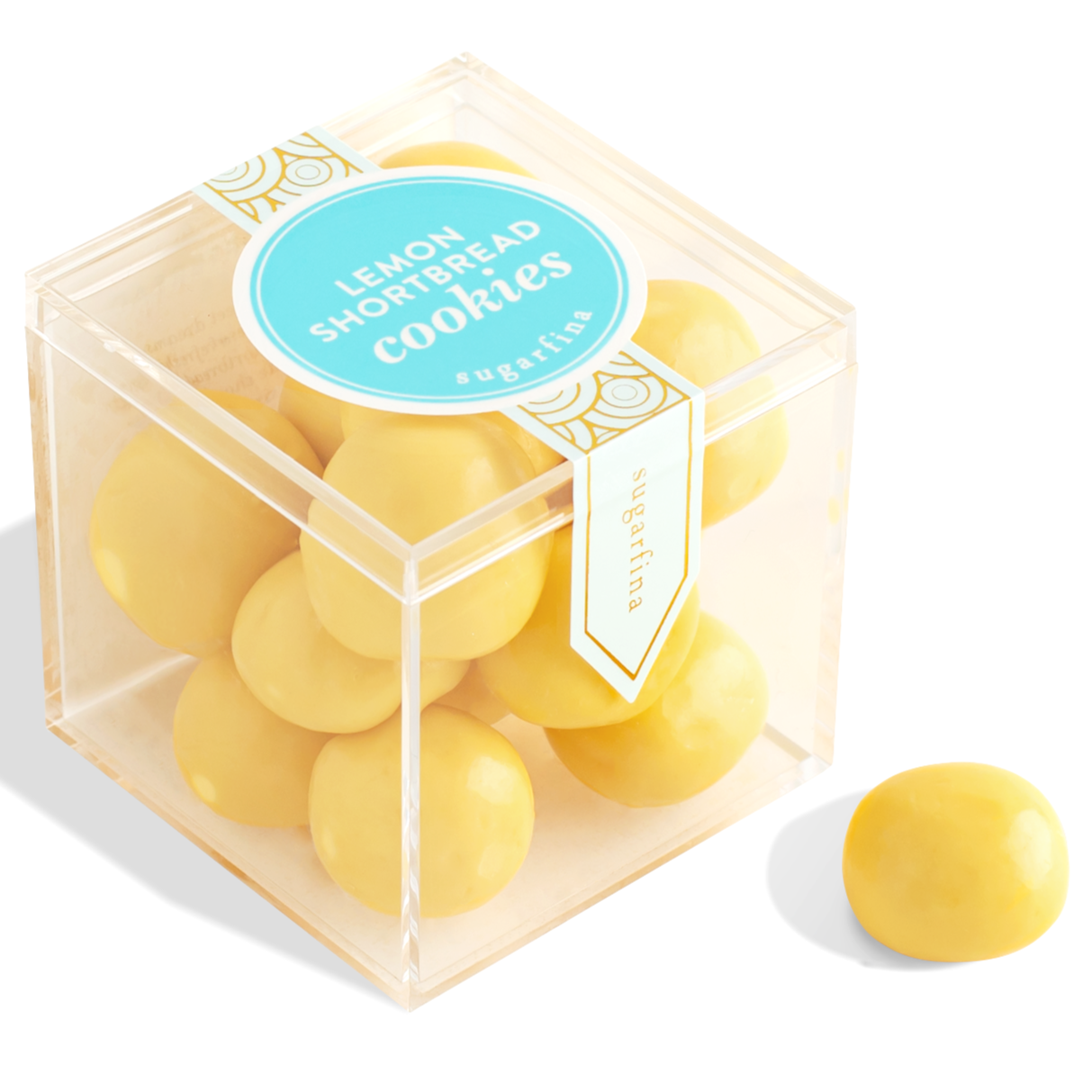 Clear cube container with yellow cookies and a blue label on a white background