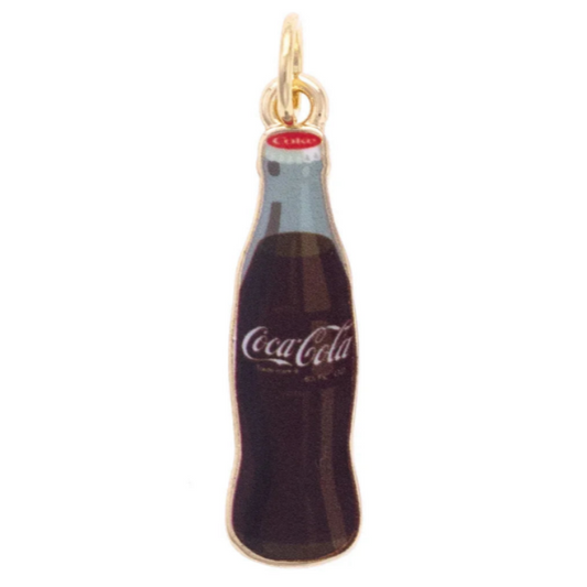 A miniature Coca-Cola bottle charm pendant with a gold-tone metal frame and cap, featuring dark brown and black enamel detailing, a light blue neck, and the white Coca-Cola script logo on the front.