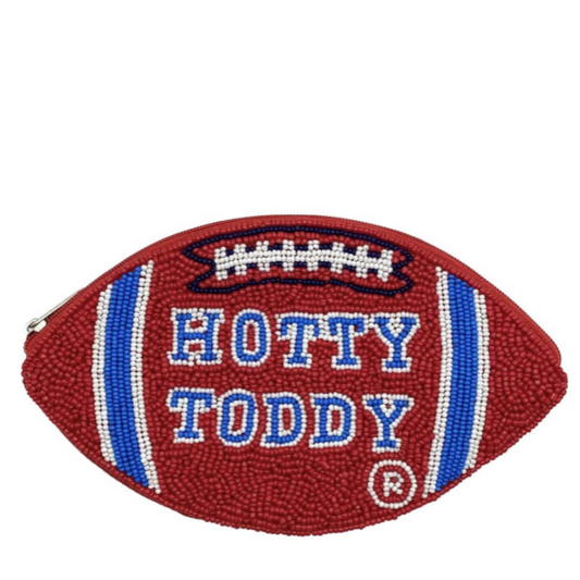 A football-shaped zipper pouch with a textured red body, blue and white stripes, and 'HOTTY TODDY' embroidered in blue and white, shown on a plain white background.