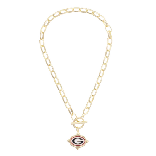 A gold paperclip chain necklace with a toggle clasp and a small diamond-shaped pendant featuring the Chicago Bears 'G' logo, displayed on a clean white background.