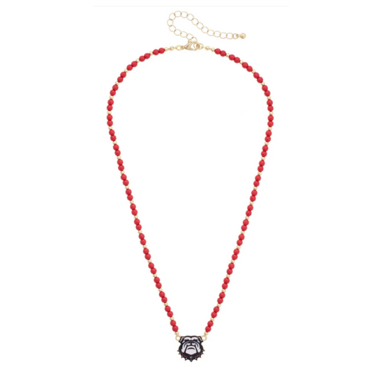 A red beaded necklace with a small black and white cat-shaped pendant, displayed on a clean white background.
