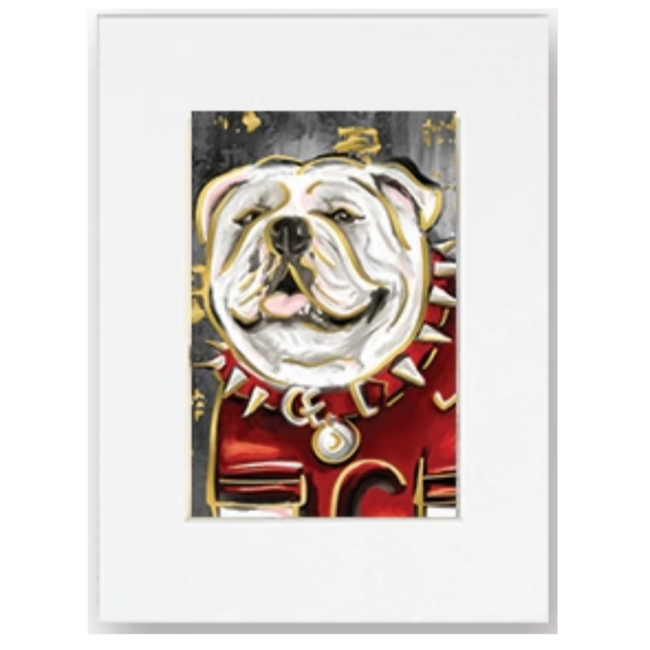 A framed art print featuring a stylized illustration of an English Bulldog wearing a red military-style uniform with gold accents, set against a clean white background.