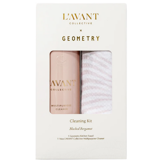 LAvANT COLLECTION x GEOMETRY Cleaning Kit in a white box with a clear window showing a pale pink bottle and a white striped cloth.