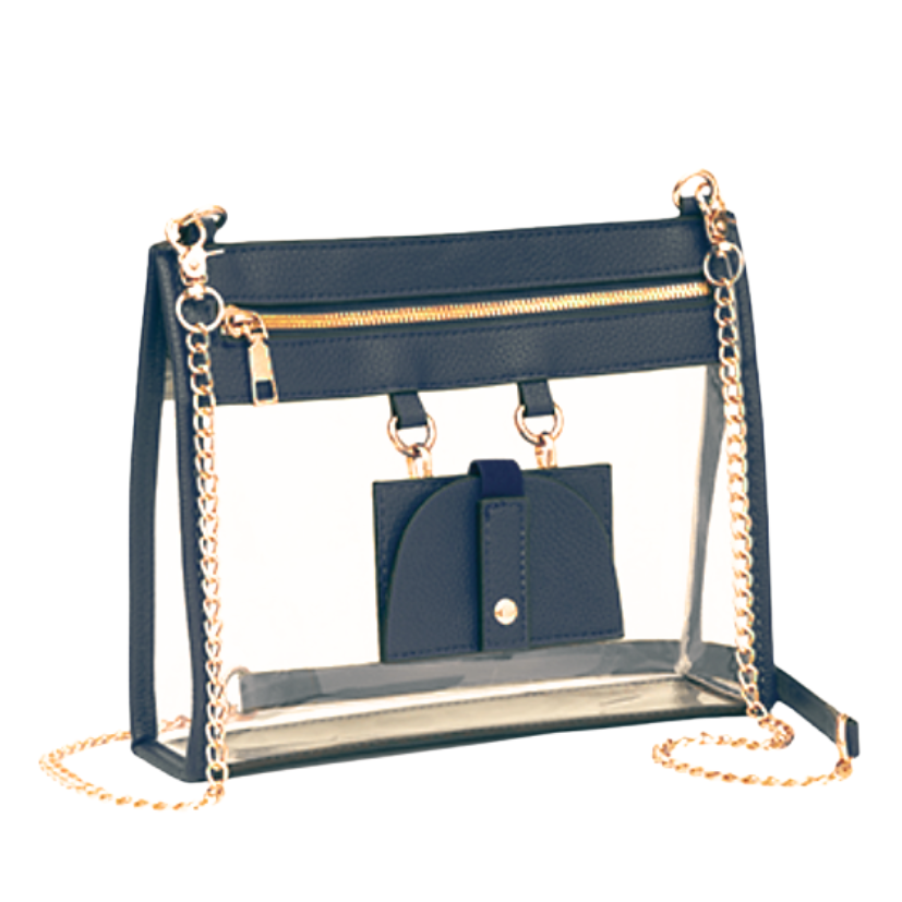 A clear acrylic shoulder bag with a black fabric top panel, gold-tone chain straps, and a matching black eye glass holder, shown on a plain white background.