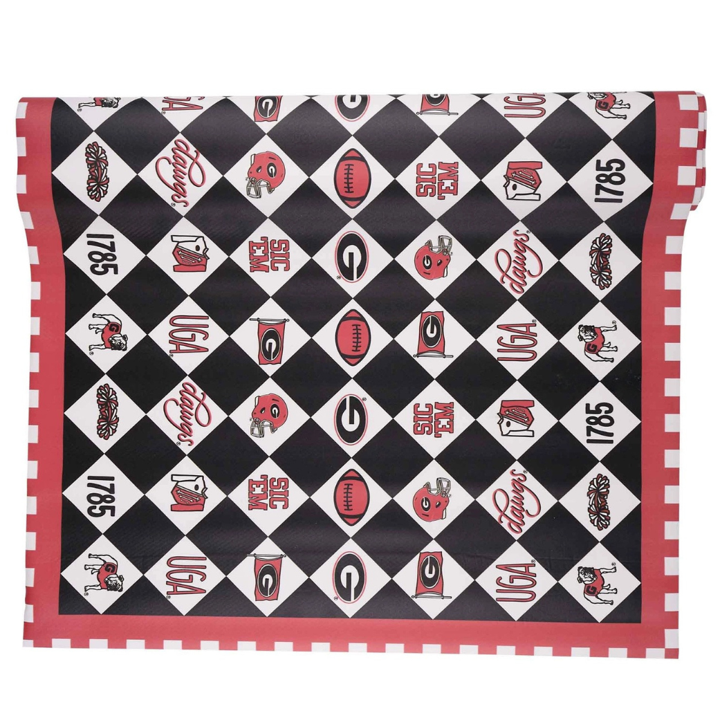 A rectangular tablecloth with a black and white diamond checkerboard pattern, decorated with red and black sports team logos, and finished with a red and white checkered border.