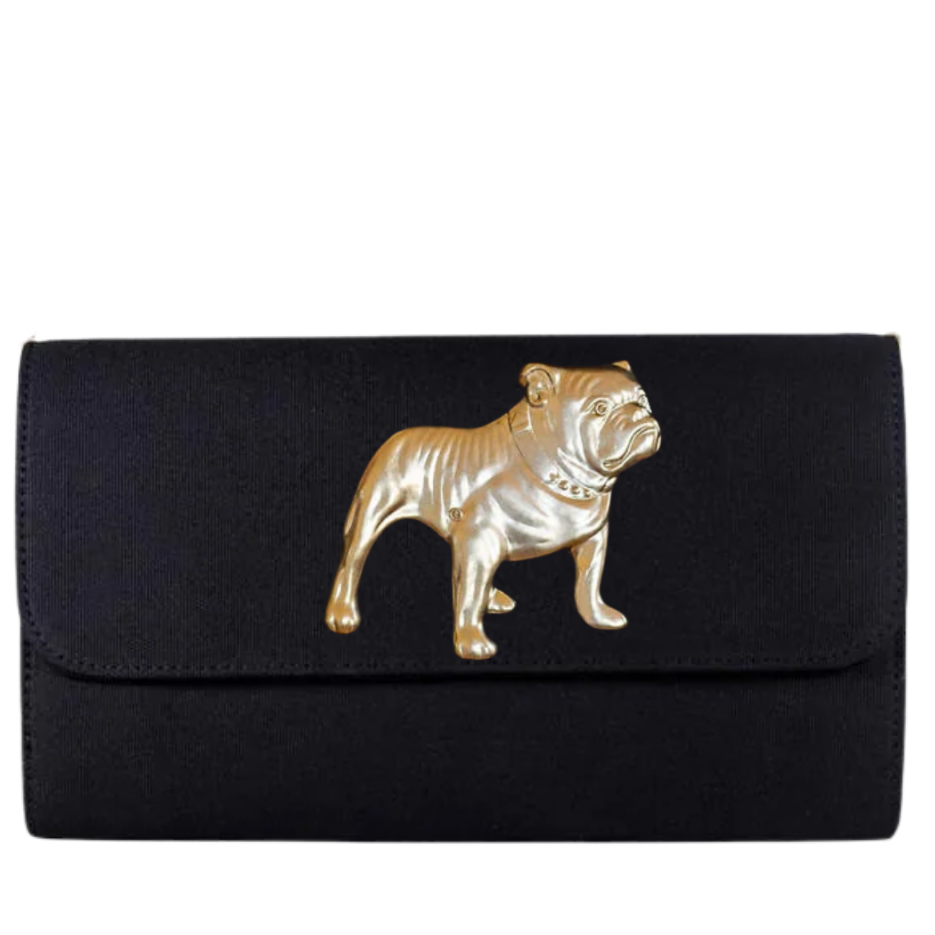 A black envelope-style clutch bag featuring a raised gold-tone bulldog emblem on the front flap, shown against a plain white background.