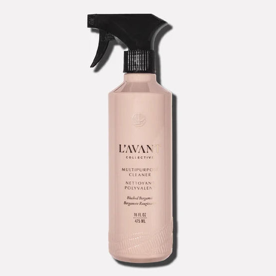 A bottle of L'Awaken Multi-Functional Exfoliator with a black spray trigger and a pale pink bottle, shown against a light gray background.