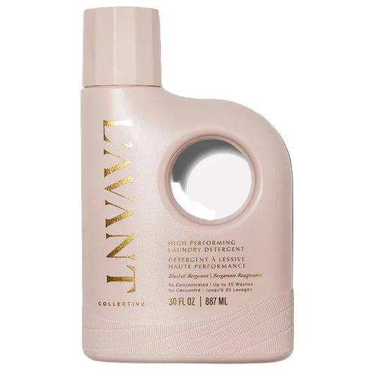 Pink bottle of laundry detergent with gold text on a white background