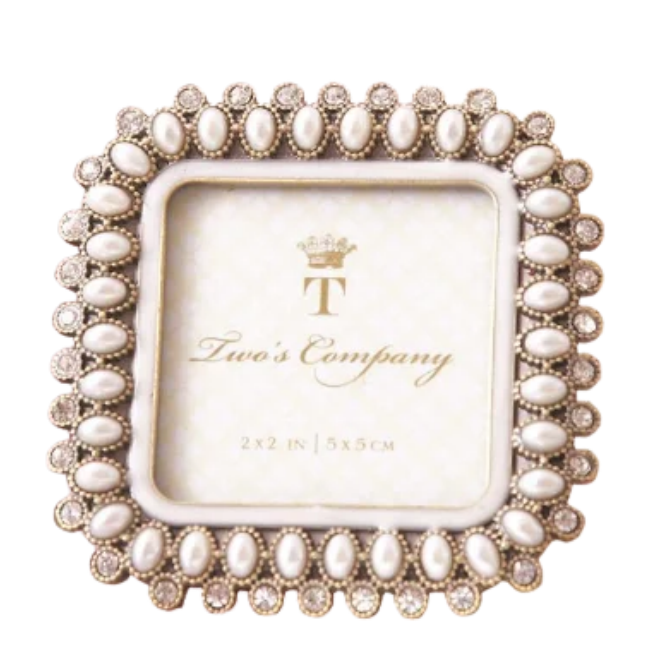 A square decorative picture frame with a beaded metallic border and a cream center panel printed with the brand name 'Tina's Company'.