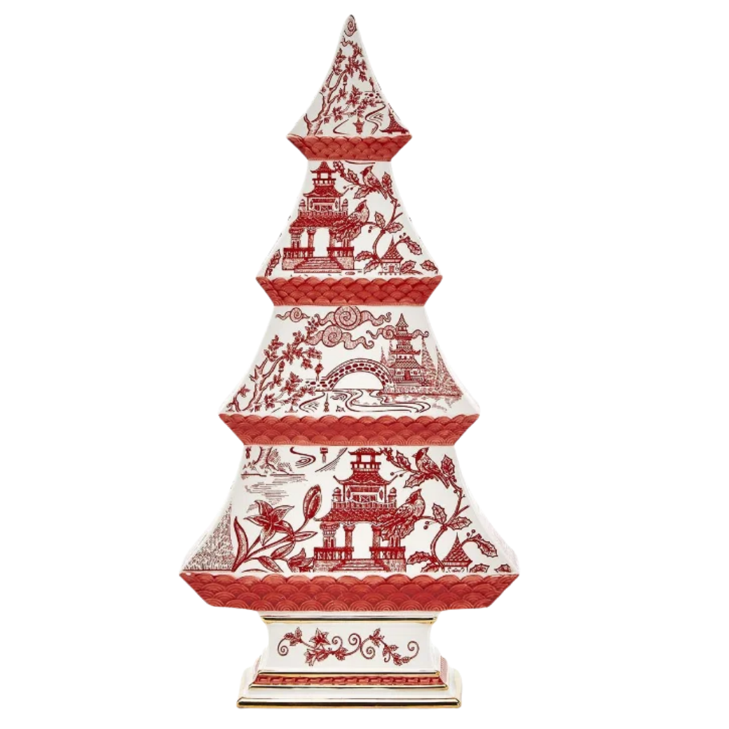 A decorative tiered pagoda-style ceramic sculpture with a red and white toile-style scene pattern, shown on a plain white background.