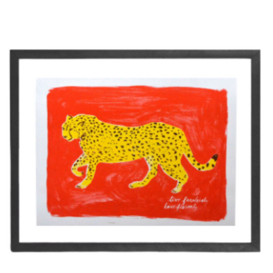 Framed artwork with a red background and yellow cheetah design on a white background