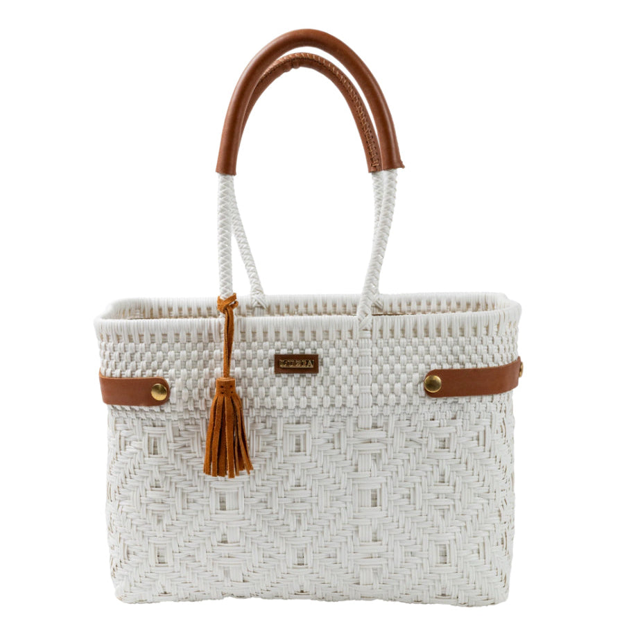 White woven handbag with brown handles and accents on a white background