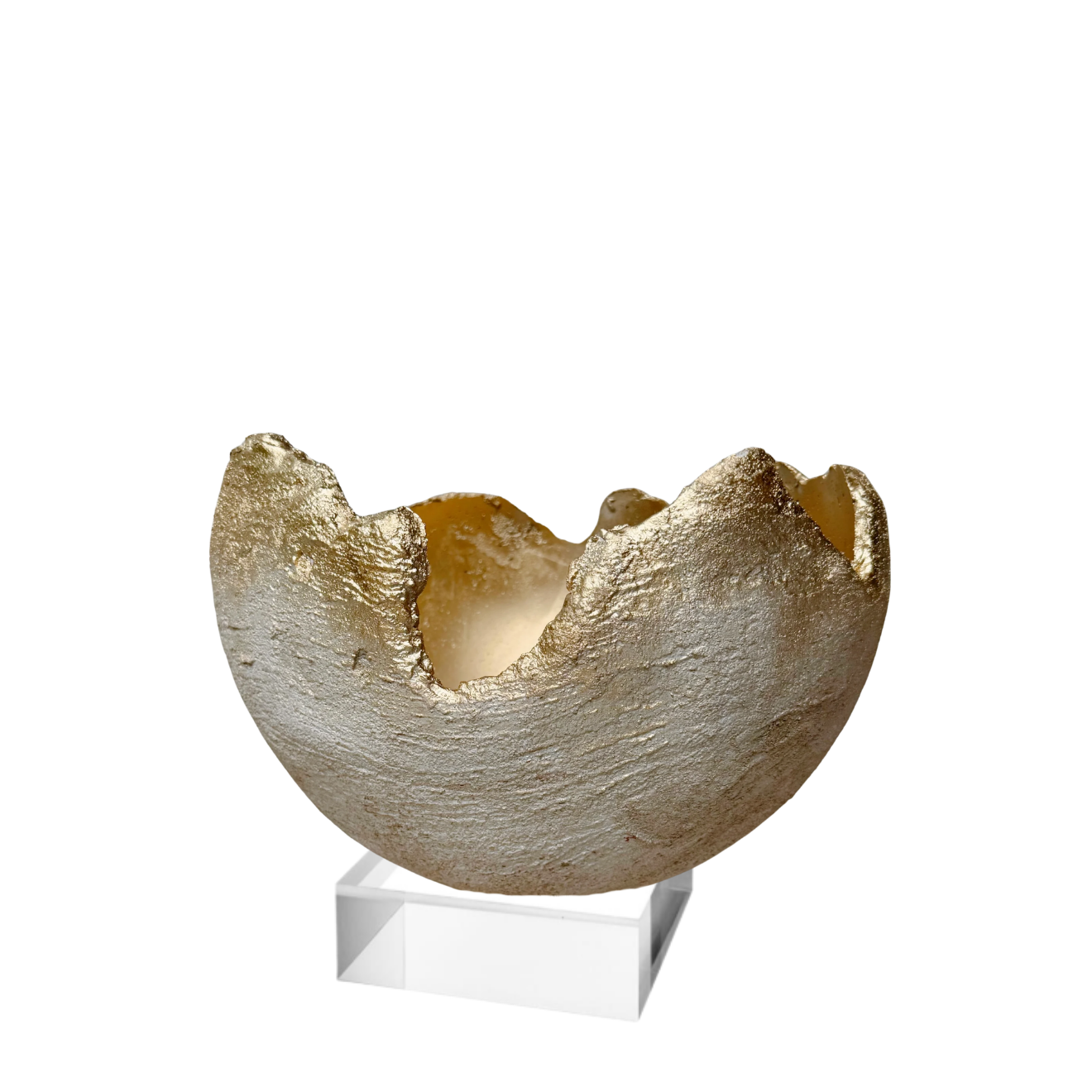 A textured, organic-shaped beige and gold decorative bowl or sculpture displayed on a clear acrylic stand against a plain white background.