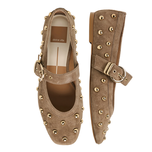 A pair of olive suede Mary Jane flats decorated with gold-tone studs and buckle straps, shown from top and side views on a white background.