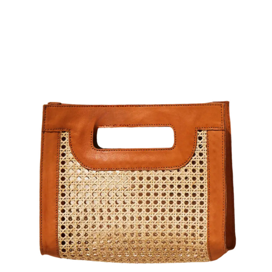 A structured tote bag featuring a natural woven cane front panel and smooth tan leather trim with a top handle cutout, shown against a plain white background.