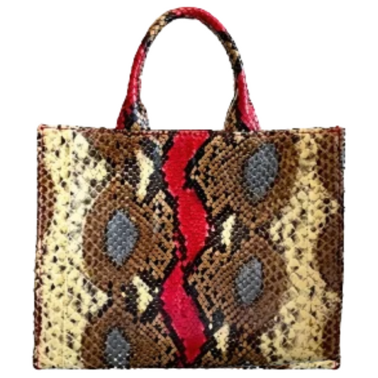 A snakeskin-patterned tote bag with brown, beige, and gray scales and a bold red vertical stripe down the center, featuring two top handles on a plain white background.