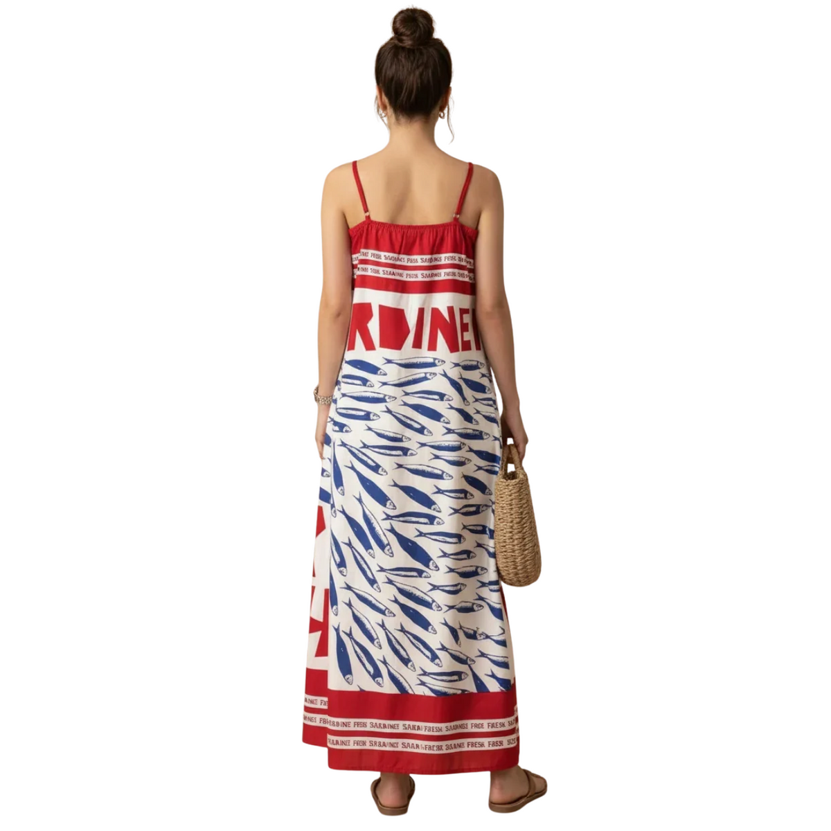 A woman is shown from behind wearing a red, white, and blue patterned maxi dress with 'ARDINE' printed across the back, holding a woven straw handbag against a solid white background.