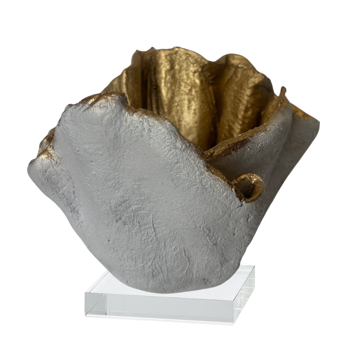 A sculptural bowl sculpture with a textured matte gray exterior and a metallic gold interior, displayed on a clear acrylic stand against a white background.