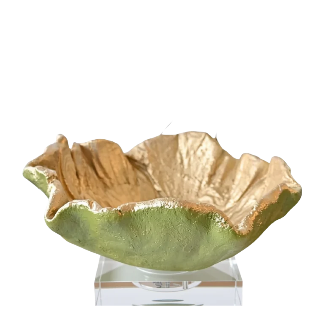A decorative leaf-shaped bowl with a textured metallic gold interior and a glossy light green exterior, displayed on a clear acrylic stand against a white background.