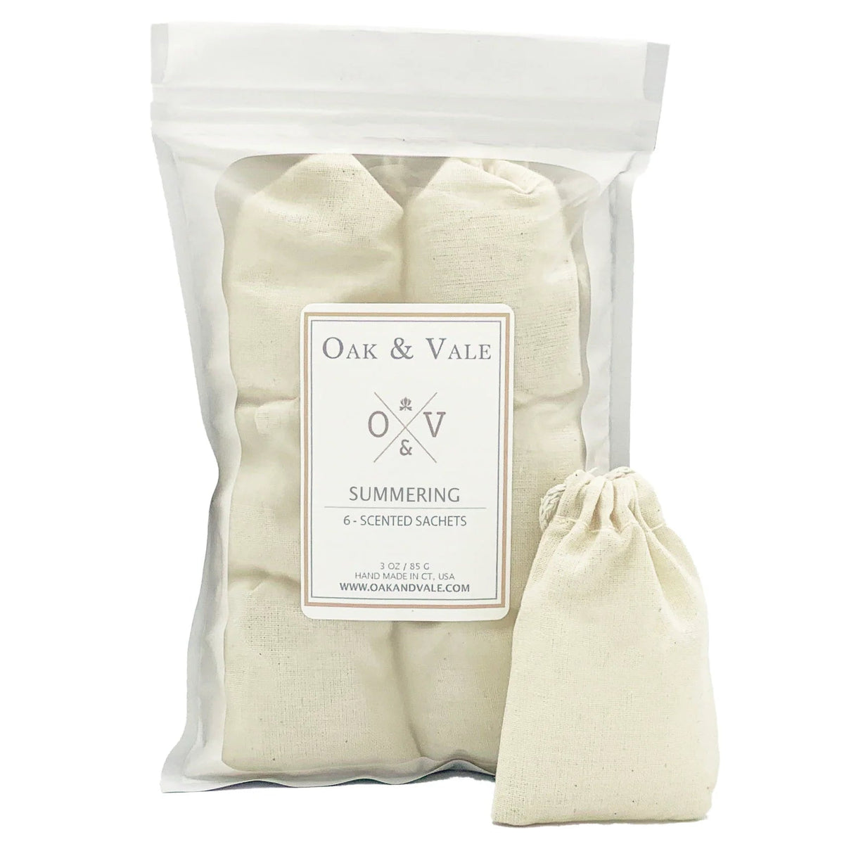 Pack of Oak & Vale scented sachets with a drawstring bag on a white background