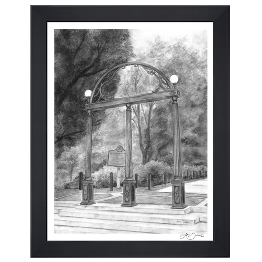 A framed black and white sketch print of the University of Georgia Arches with North Campus in the background, shown in a black frame against a white backdrop.