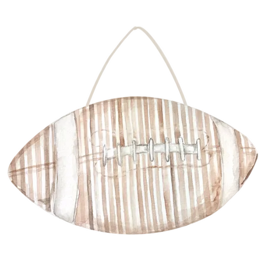 Watercolor-style football wall hanging with a white hanging string, featuring vertical tan and beige stripes with white laces on a white background.