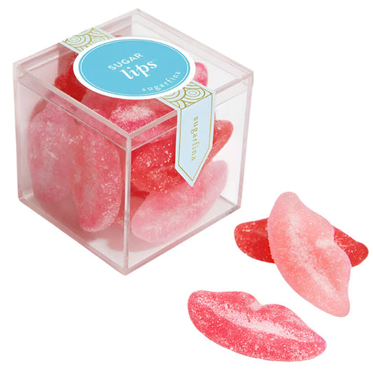 Pink candy shaped like lips in a clear box with a blue label on a white background