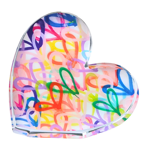 Heart-shaped object with colorful abstract patterns on a white background