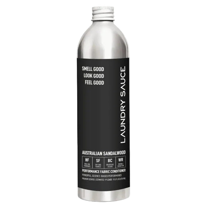 A silver aluminum bottle of Laundry Sauce Australian Sandalwood performance fabric conditioner with a black label, shown on a white background with black arrows on the sides.