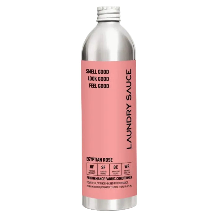 A silver aluminum bottle of Laundry Sauce 'Egyptian Rose' performance fabric conditioner, featuring a pink label with black text, set against a light off-white background.