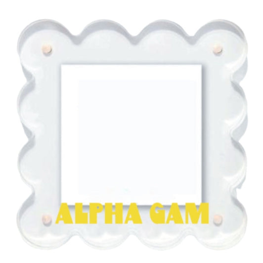 Decorative item with 'Alpha Gam' text on a white background