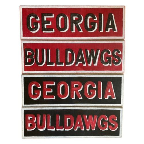 Four rectangular wooden signs with 'Georgia Bulldogs' text in different orientations on a white background.